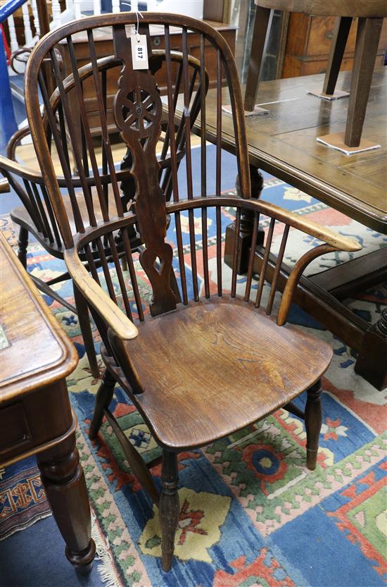 A pair of wheelback armchairs